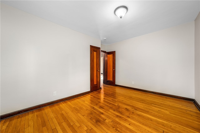 unfurnished room featuring light wood-type flooring