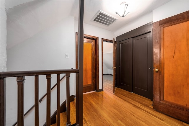 hallway with light wood-type flooring