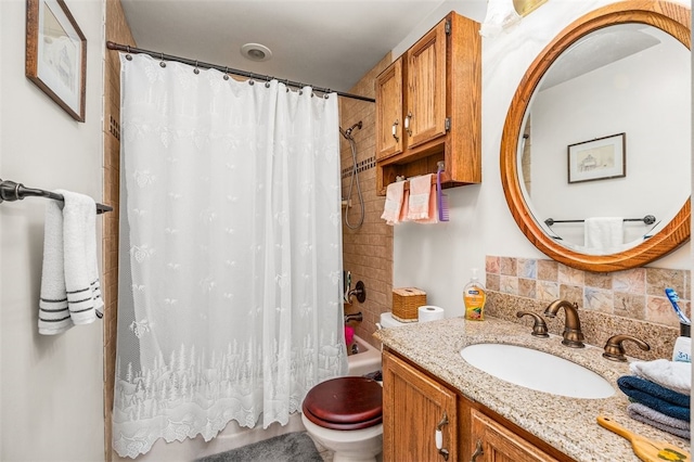 full bathroom with vanity, shower / bath combo with shower curtain, toilet, and tasteful backsplash