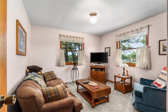 living room with light carpet and a healthy amount of sunlight