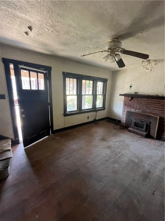 interior space featuring wood-type flooring, a textured ceiling, and ceiling fan