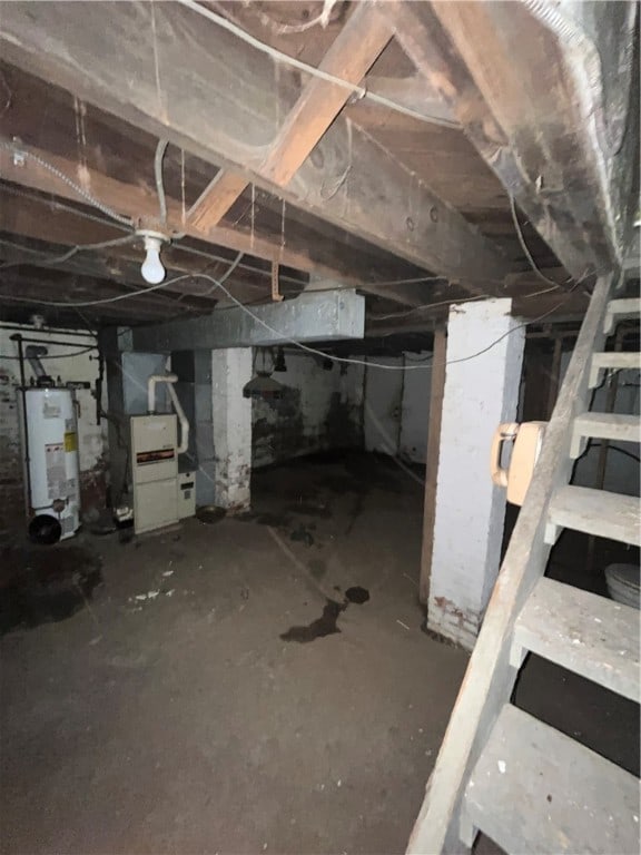 basement with gas water heater and heating unit