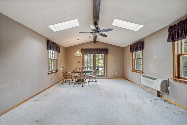 unfurnished dining area with lofted ceiling with beams, ceiling fan, carpet, and a wall mounted AC