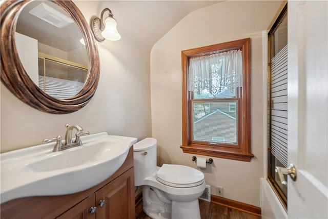 full bathroom with wood-type flooring, shower / bath combination with glass door, vanity, toilet, and lofted ceiling