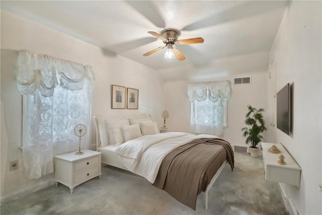 bedroom featuring ceiling fan, lofted ceiling, and light colored carpet