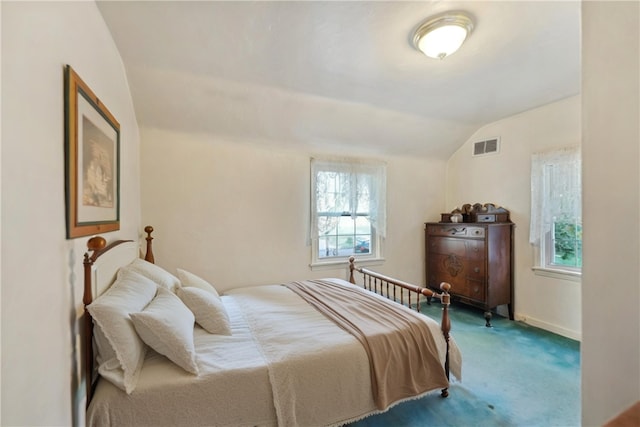 bedroom with carpet flooring and vaulted ceiling