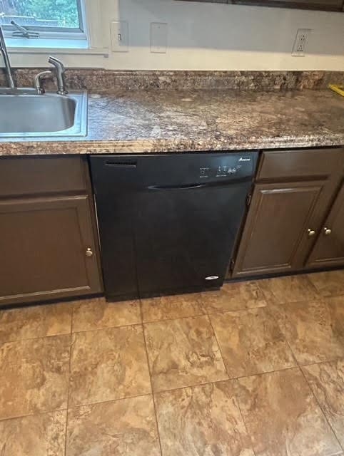 kitchen featuring dark brown cabinets, dishwasher, and sink