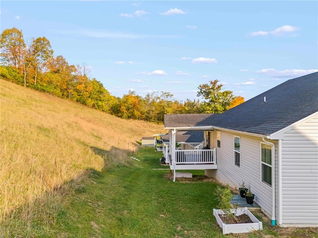 view of yard featuring a wooden deck