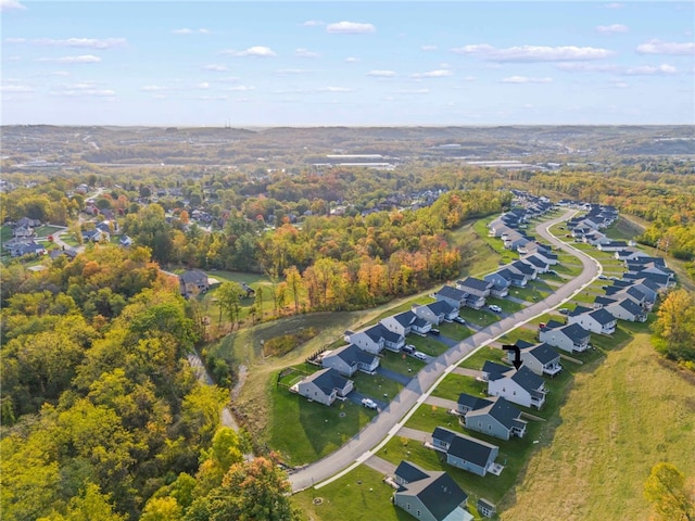 birds eye view of property with a residential view and a view of trees