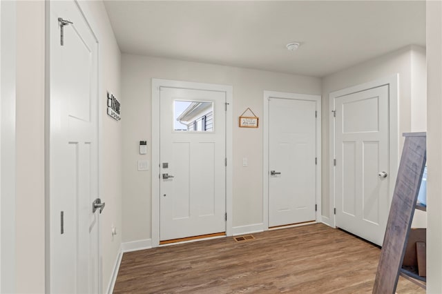 foyer entrance with hardwood / wood-style floors