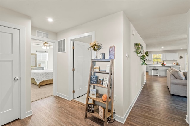 corridor featuring hardwood / wood-style flooring