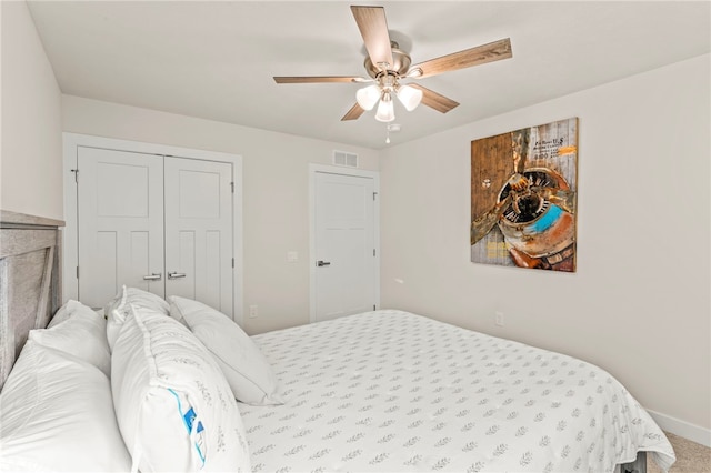 bedroom featuring a closet, carpet flooring, and ceiling fan