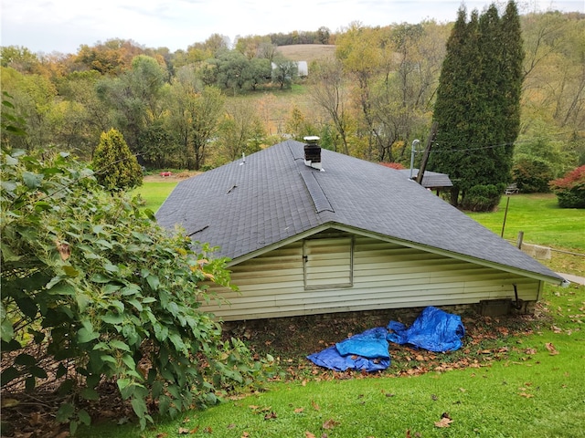 view of home's exterior with a yard