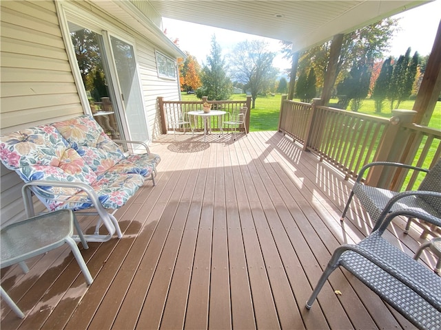 deck featuring a lawn