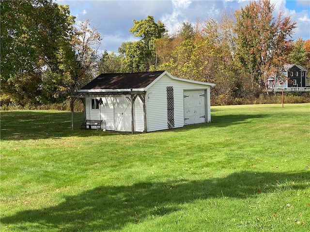 view of outbuilding featuring a yard