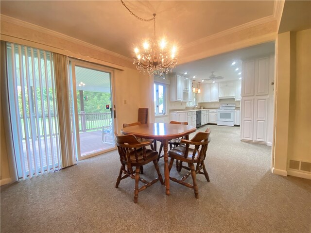 dining room with ornamental molding, light carpet, and an inviting chandelier