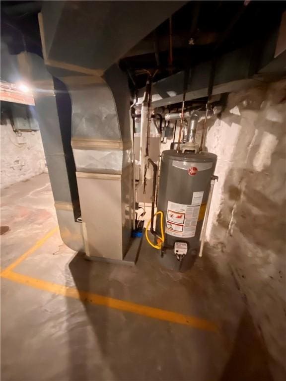 utility room with water heater and heating unit