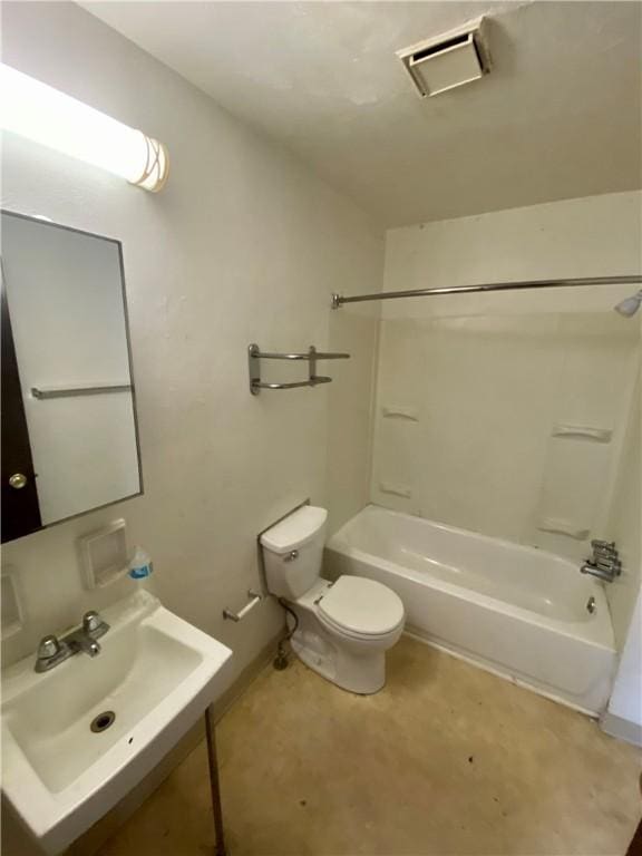 bathroom featuring a sink, toilet, shower / bath combination, and baseboards