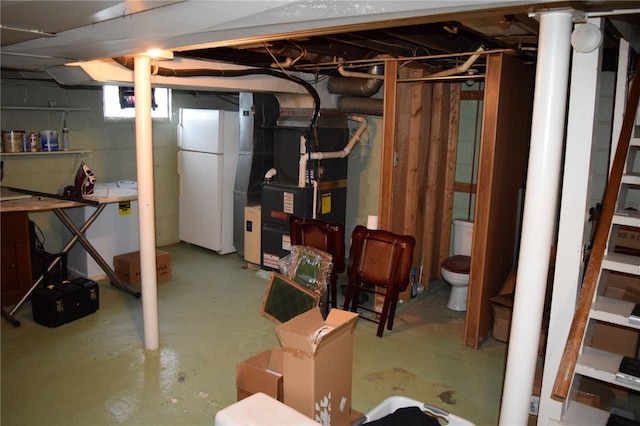 basement with white fridge