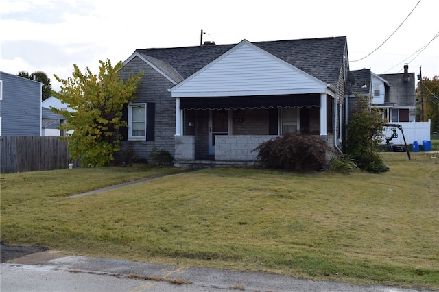 view of front of property featuring a porch and a front lawn