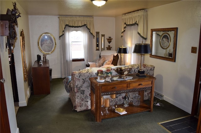 bedroom with dark colored carpet