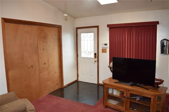 foyer entrance featuring vaulted ceiling