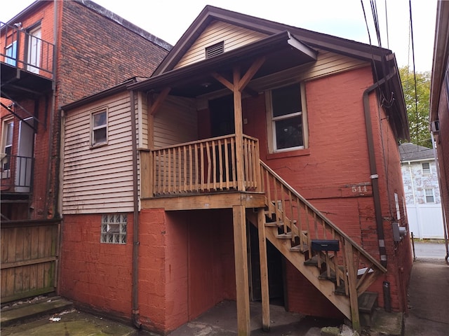 back of house with a balcony