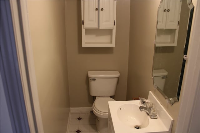 bathroom with sink, tile patterned flooring, and toilet