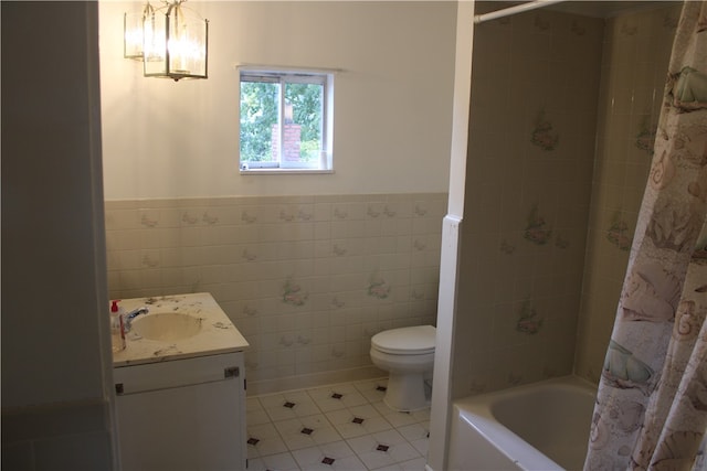 full bathroom featuring vanity, tile walls, toilet, and shower / bathtub combination with curtain