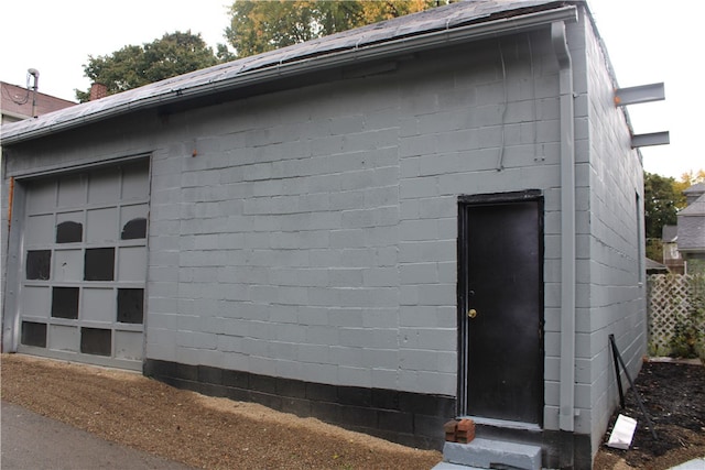 view of property exterior with a garage