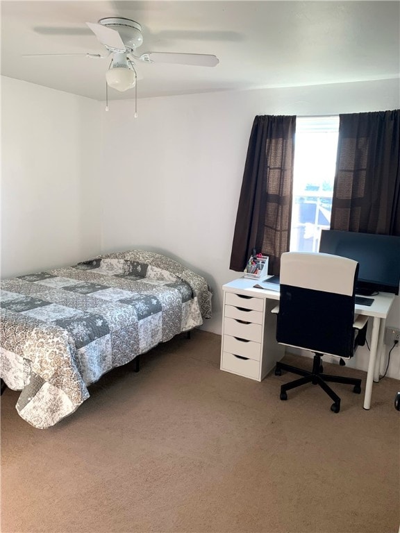 carpeted bedroom with ceiling fan