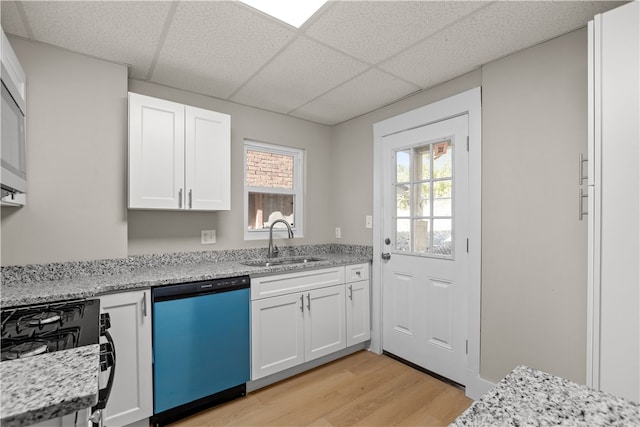 kitchen featuring white cabinetry, sink, light hardwood / wood-style floors, and dishwasher