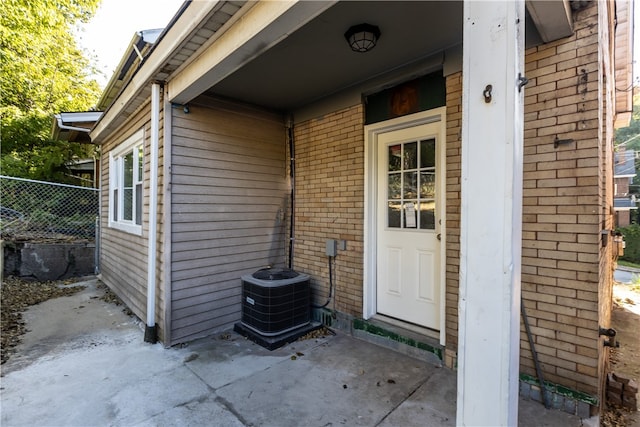 doorway to property with central air condition unit