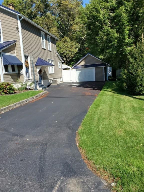 exterior space with driveway and entry steps