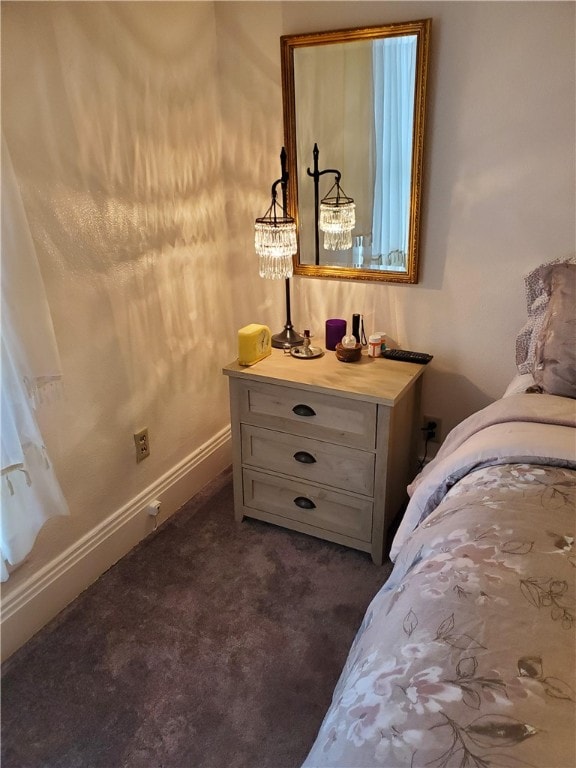 bedroom featuring dark colored carpet