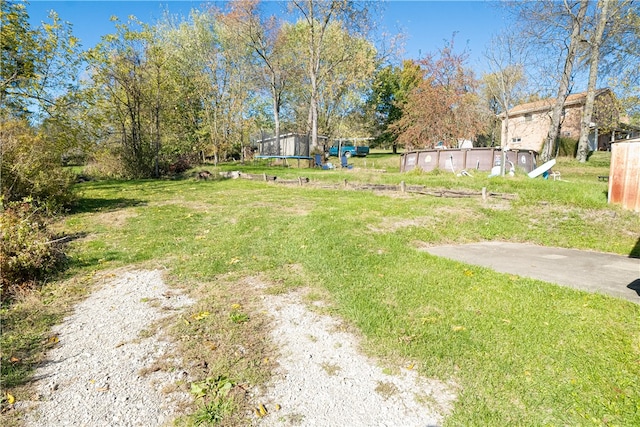 view of yard with a trampoline