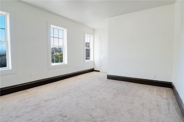 empty room with light colored carpet