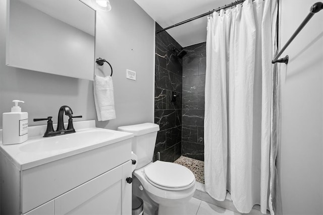 bathroom with vanity, tile patterned flooring, toilet, and curtained shower