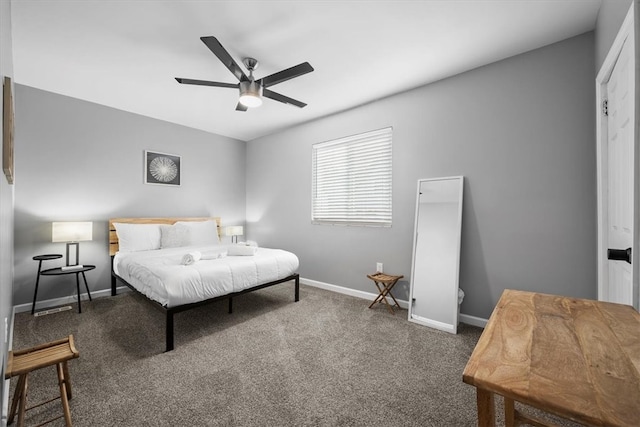 bedroom with dark colored carpet and ceiling fan