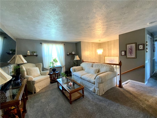 carpeted living room with a textured ceiling