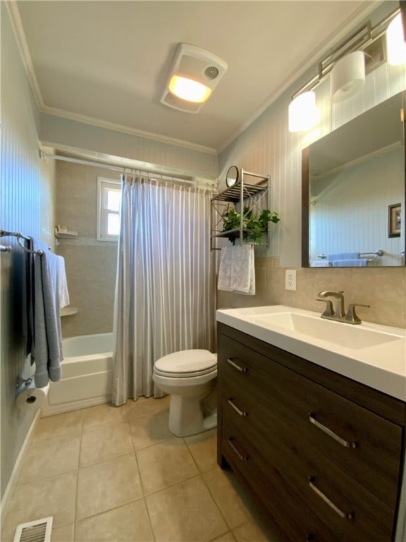 full bathroom featuring ornamental molding, shower / bath combo, tile patterned floors, toilet, and decorative backsplash