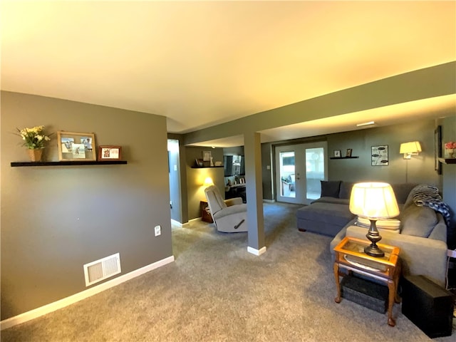 carpeted living room with french doors