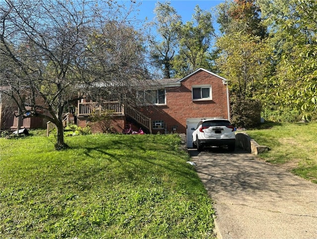 view of front of house with a front yard and a garage