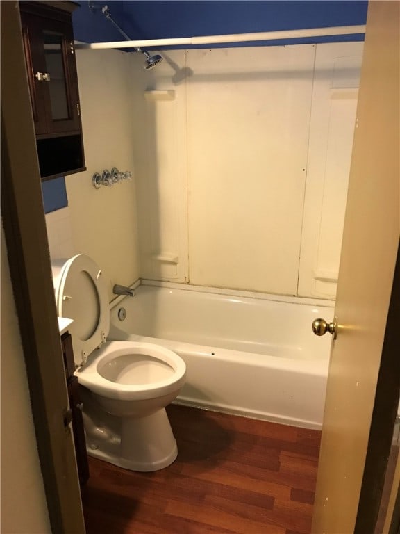 full bathroom with vanity, hardwood / wood-style flooring, toilet, and shower / washtub combination