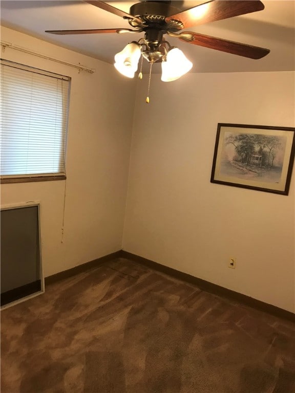 carpeted empty room with ceiling fan