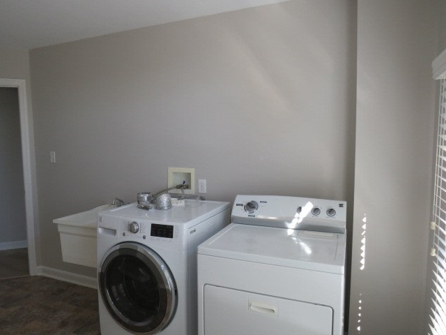 clothes washing area with independent washer and dryer