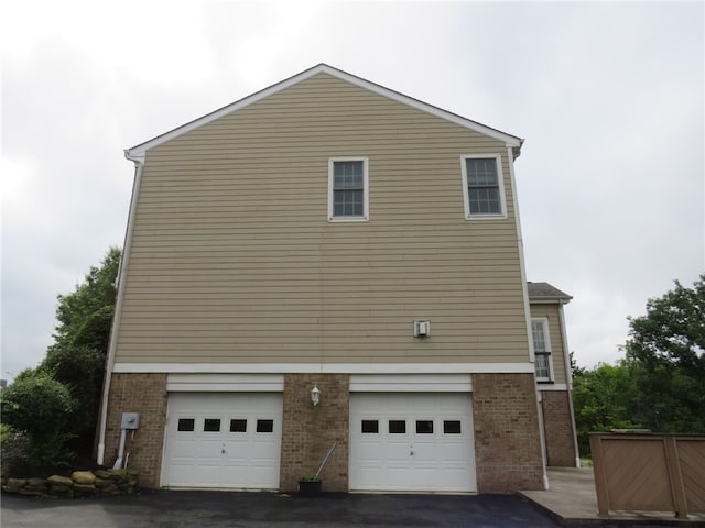 view of side of property with a garage