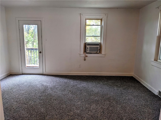 carpeted spare room with cooling unit