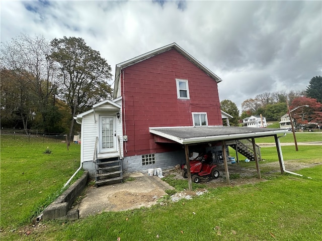 rear view of house with a yard