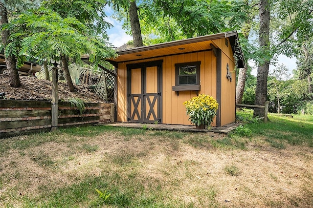 view of outdoor structure with a lawn